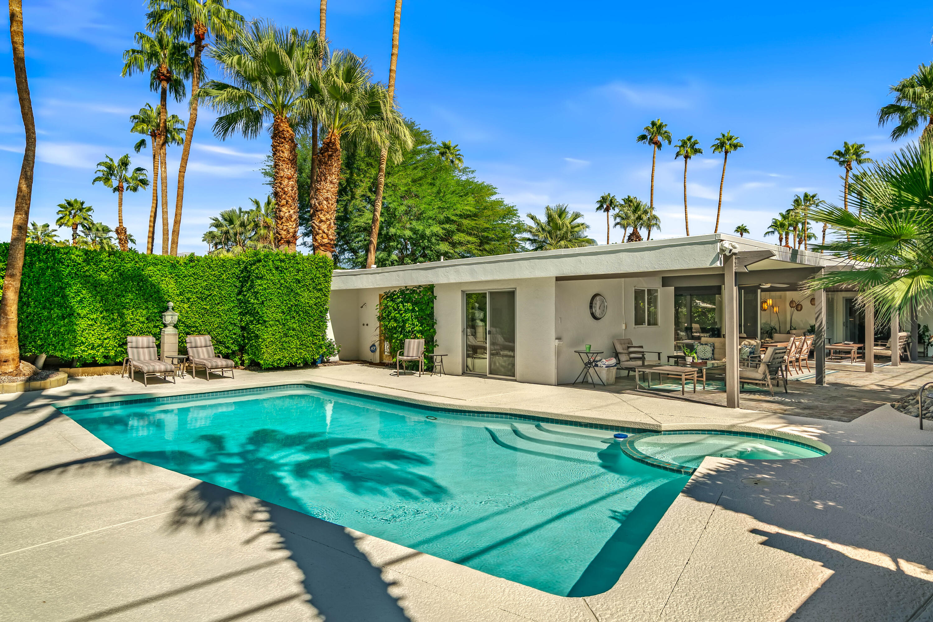 823 San Lucas Road Palm Springs, CA 92264 - Photo 47 of 71 a view of a house with a yard patio and swimming pool