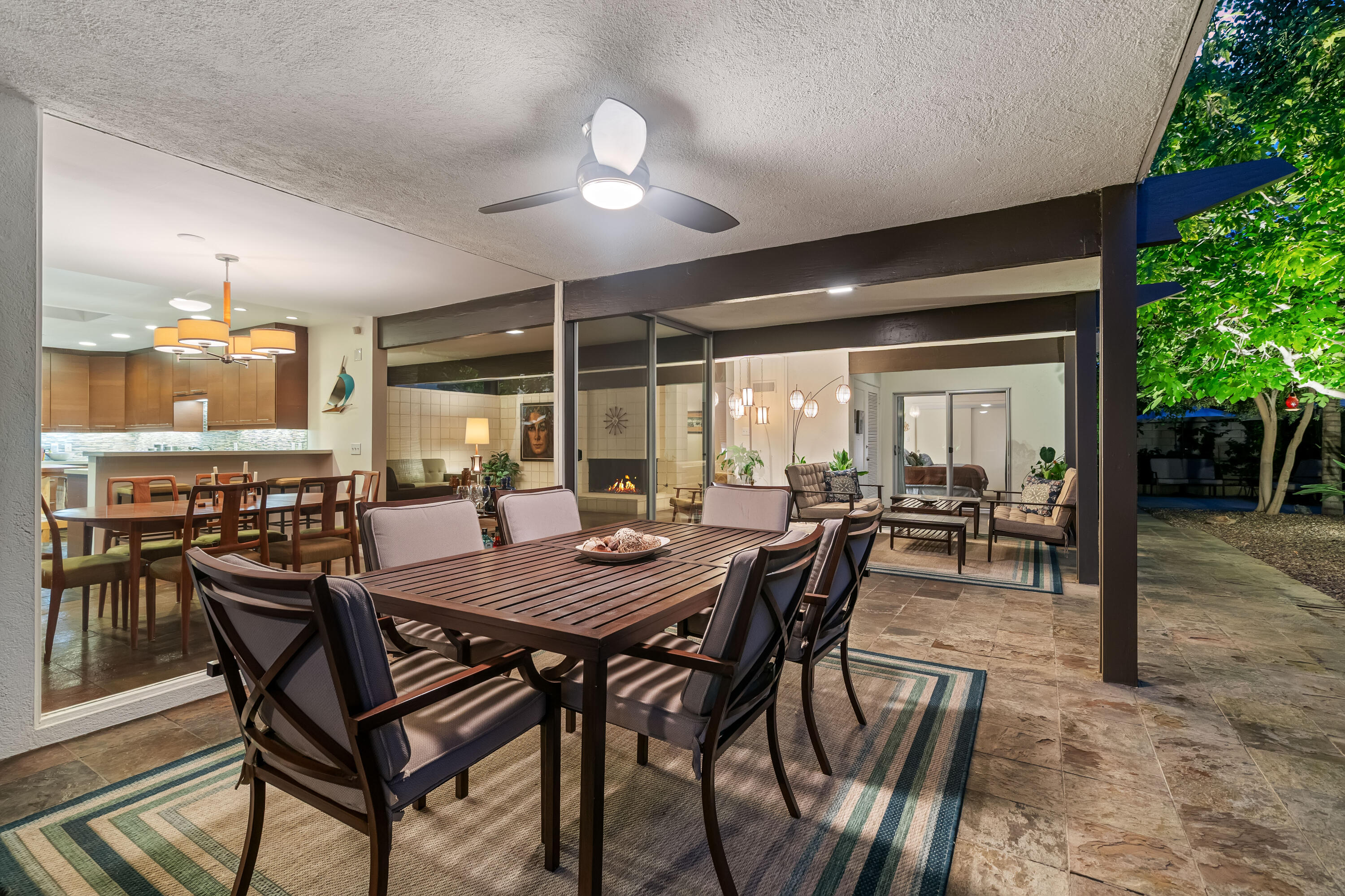 823 San Lucas Road Palm Springs, CA 92264 - Photo 61 of 71 a view of a dining room with furniture and wooden floor