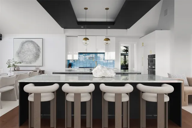 a kitchen with granite countertop a sink and cabinets
