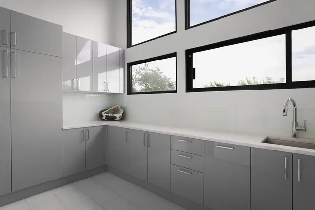 a kitchen with a sink and cabinets