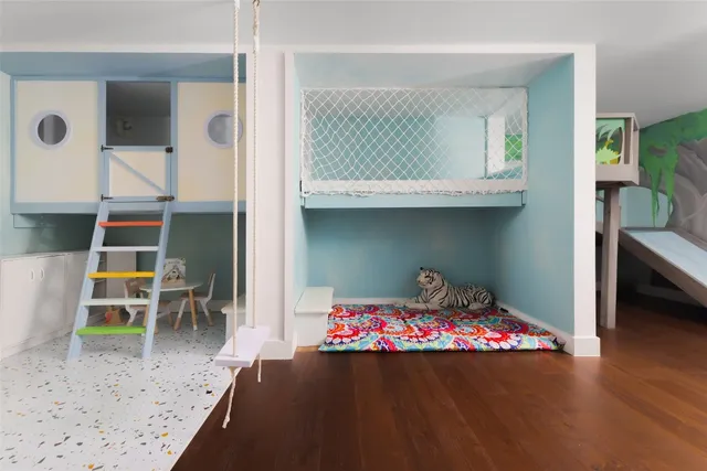 a room with wooden floor and a chair