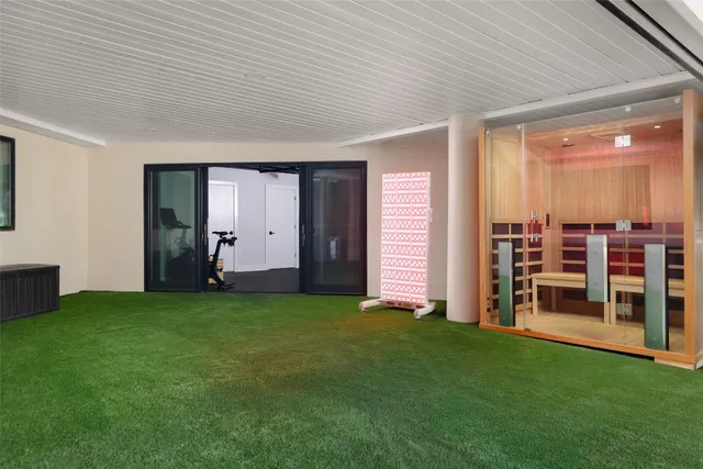 a dining room with furniture and a window