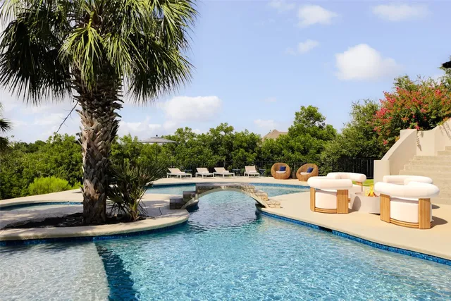 a view of a swimming pool with a patio