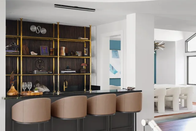 a dining room with furniture and a window