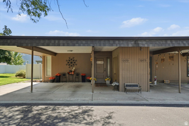 1025 Bristol Road Fruit Heights, UT 84037 - Photo 2 of 20 Carport featuring a shingled roof and concrete pad