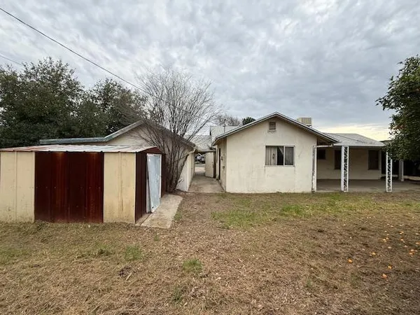 a house with trees in the background