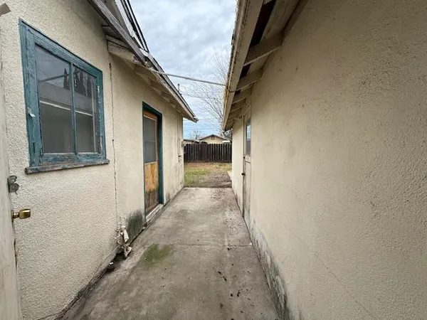 a view of a house with a street