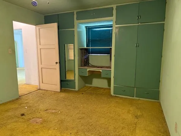 a room with closet and a shower