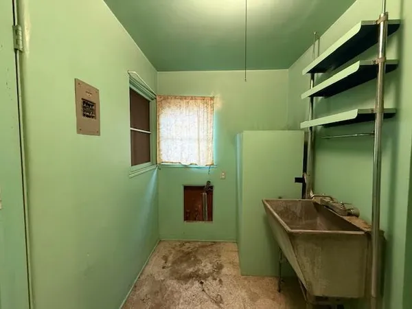a bathroom with a sink and mirror