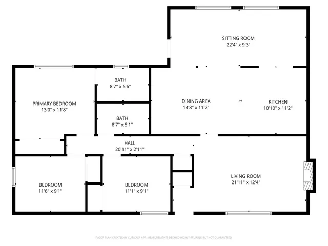 an aerial view of a house with a garden and trees