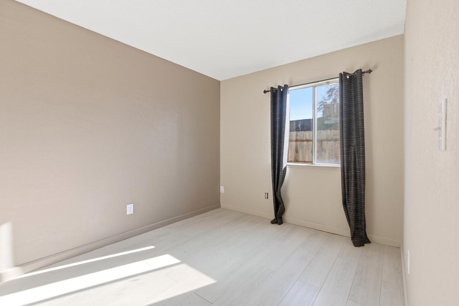 3713 Felkirk Way Modesto, CA 95356 - Photo 9 of 16 a view of an empty room and window