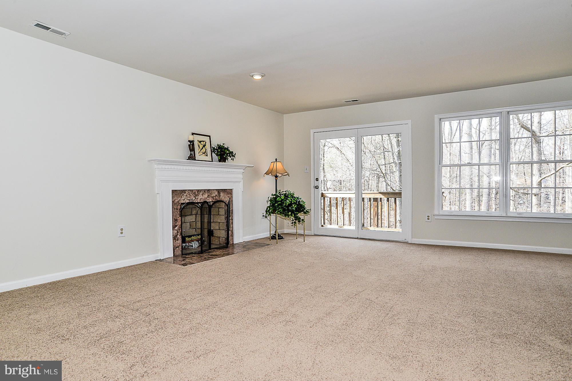 8664 Center Road Springfield, VA 22152 - Photo 14 of 30 Master Bedroom with wood burning fireplace