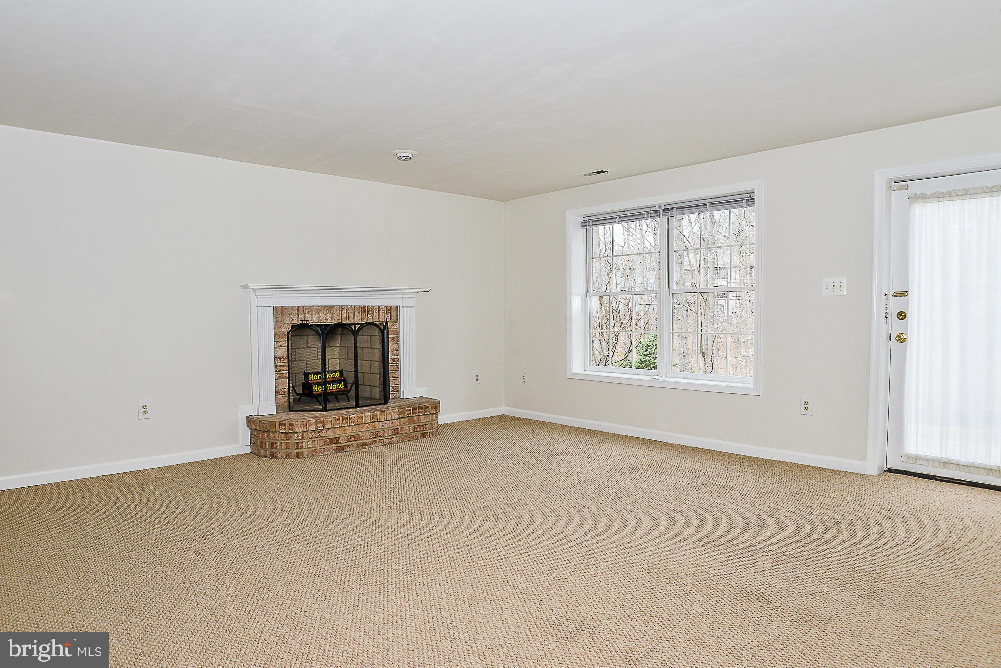 8664 Center Road Springfield, VA 22152 - Photo 24 of 30 Basement with wood burning fireplace