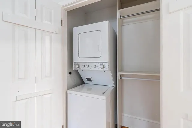 a view of washer and dryer with wooden floor