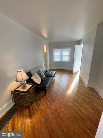a kitchen with granite countertop a sink stove and cabinets