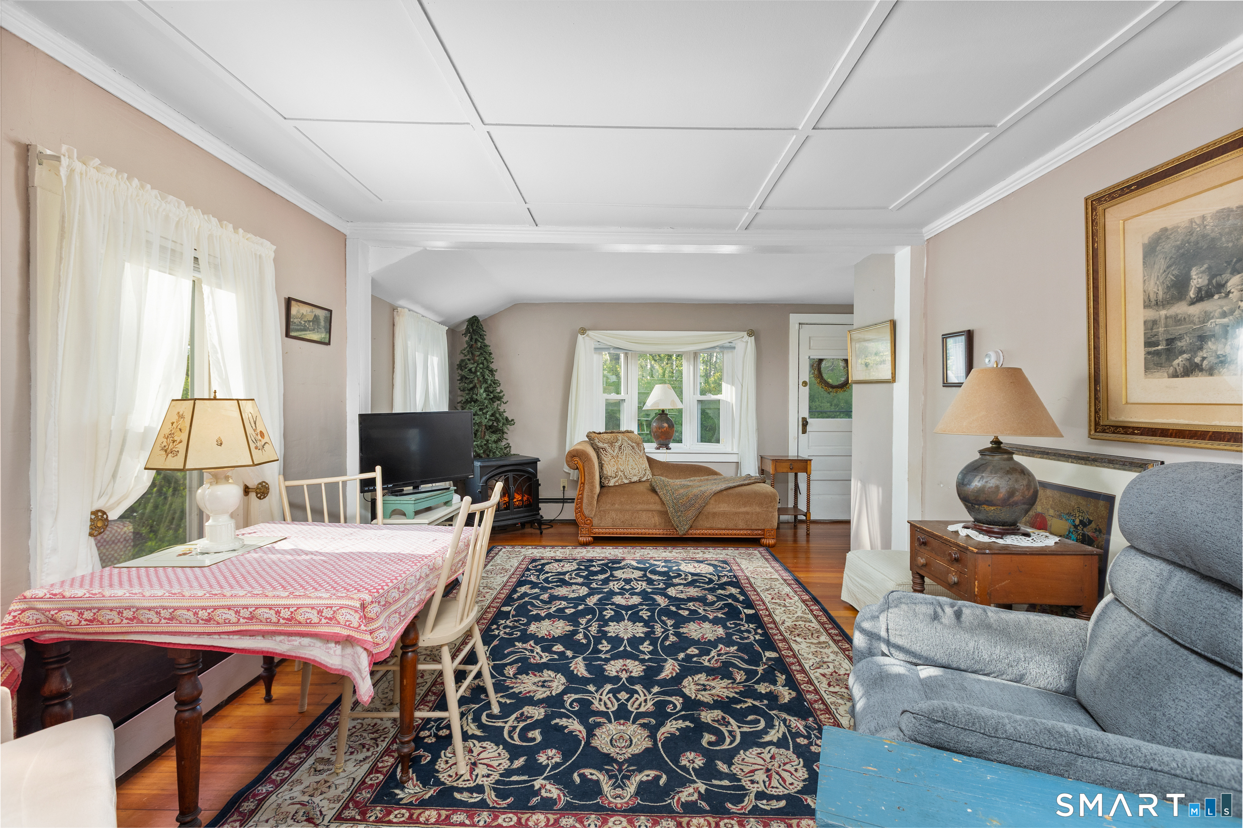 99 Halls Hill Road Killingly, CT 06239 - Photo 17 of 19 a bedroom with a bed and wooden floor