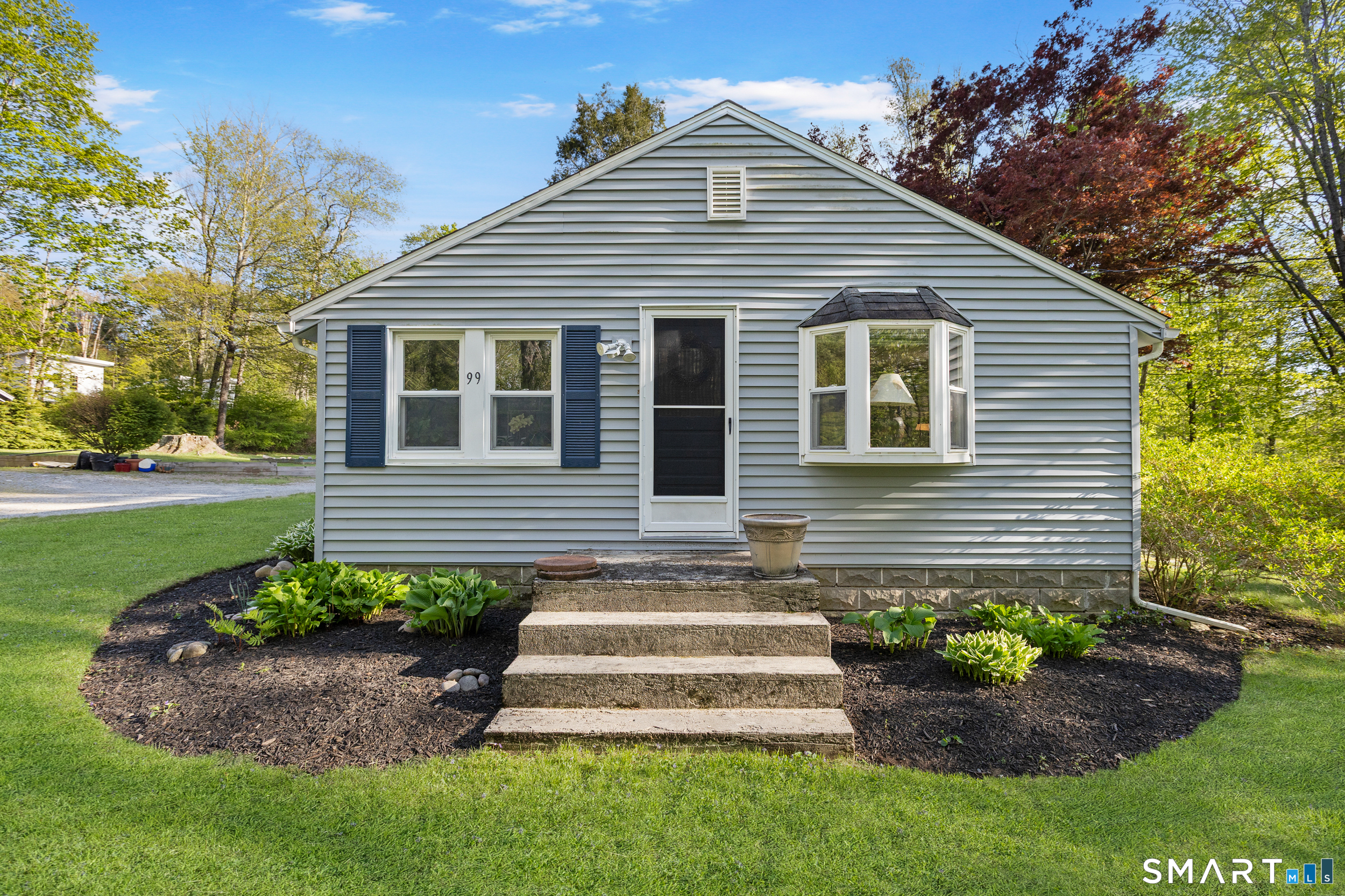 99 Halls Hill Road Killingly, CT 06239 - Photo 3 of 19 a front view of a house with a garden