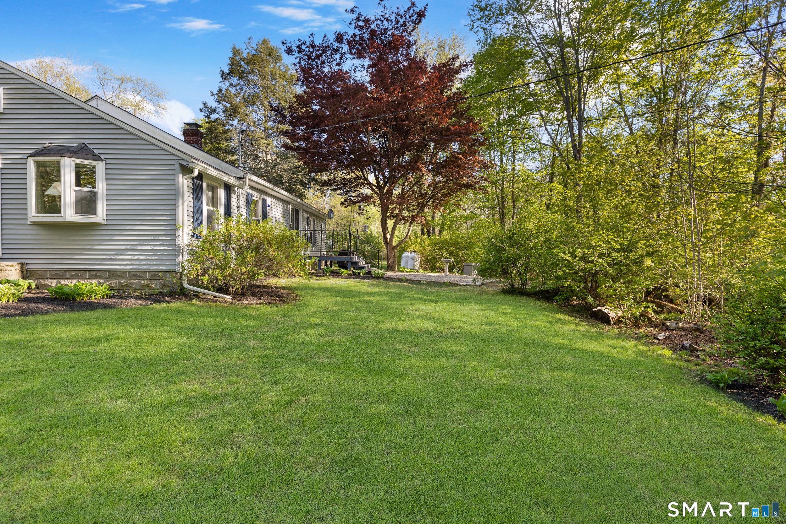 99 Halls Hill Road Killingly, CT 06239 - Photo 5 of 19 a backyard of a house with lots of green space