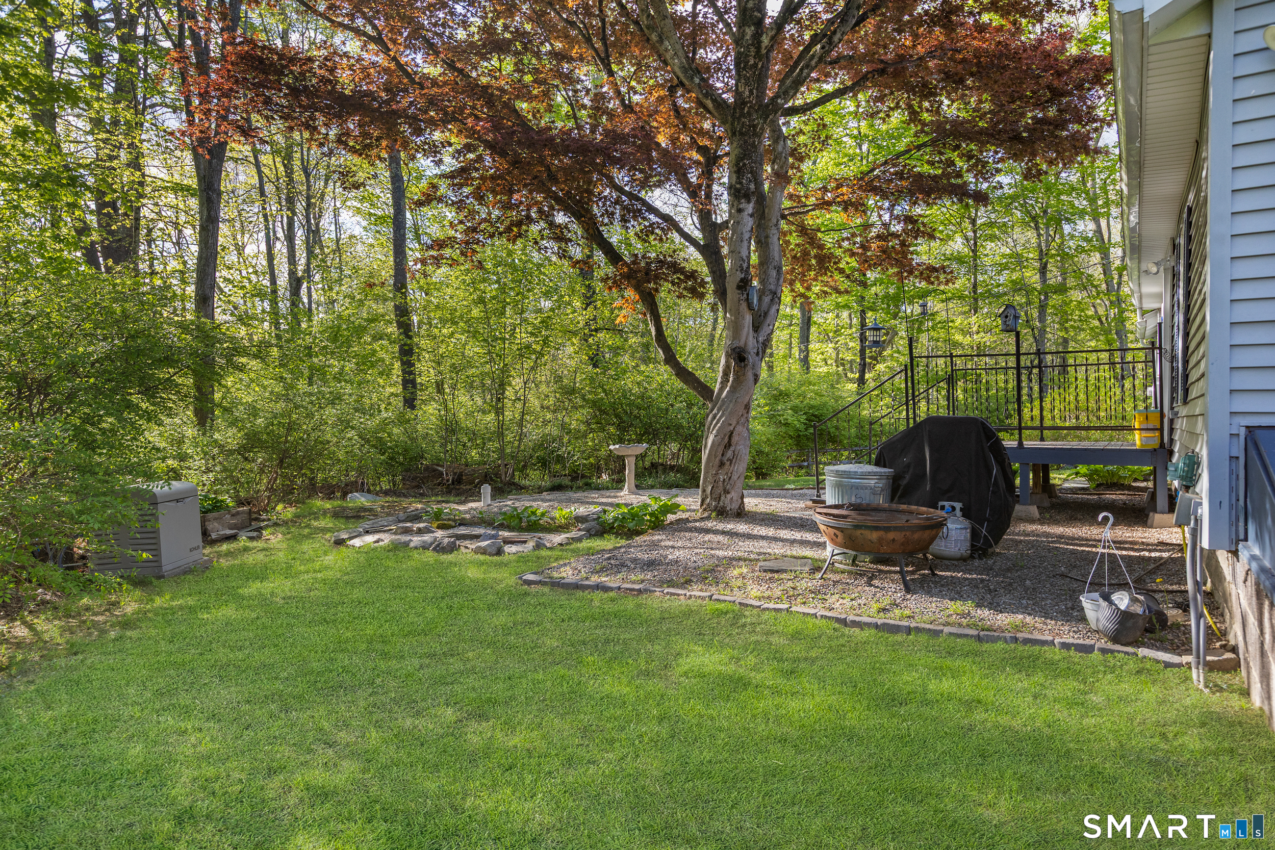 99 Halls Hill Road Killingly, CT 06239 - Photo 6 of 19 a backyard of a house with barbeque oven and outdoor seating