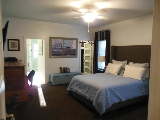 a bathroom with a double vanity sink mirror and shower