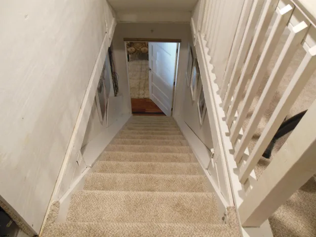 a bed room with furniture and a flat screen tv