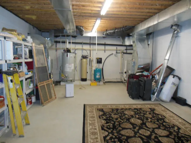 a view of a house with a backyard and a tree