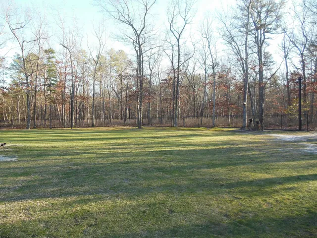 a view of street with parked cars