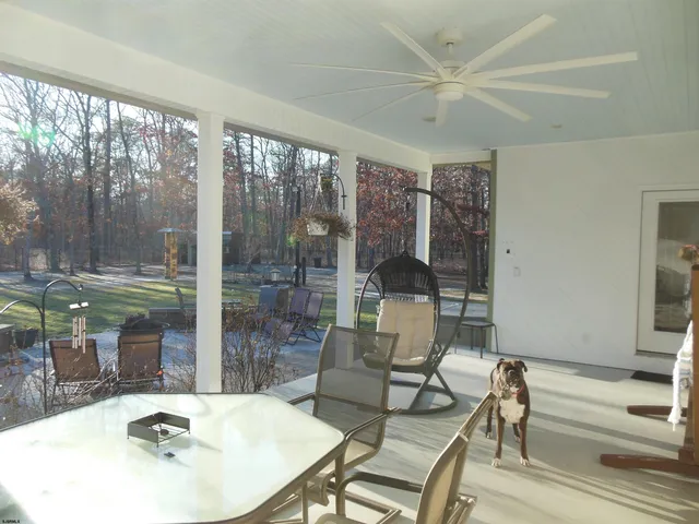 a view of a backyard with sitting area