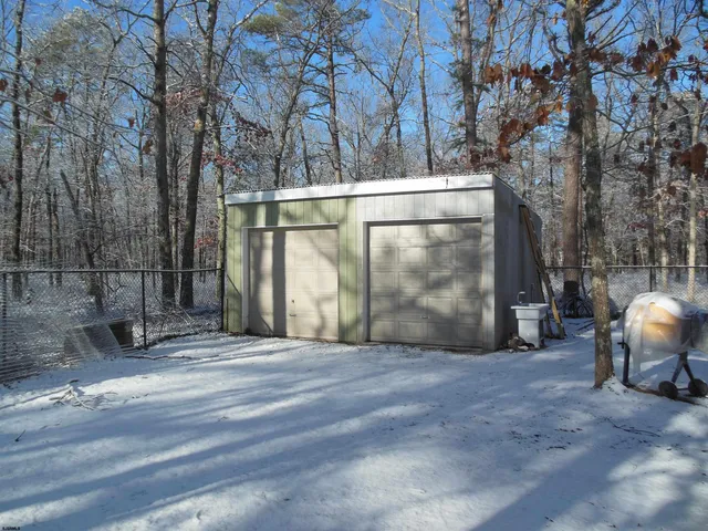 a kitchen with sink refrigerator and cabinets
