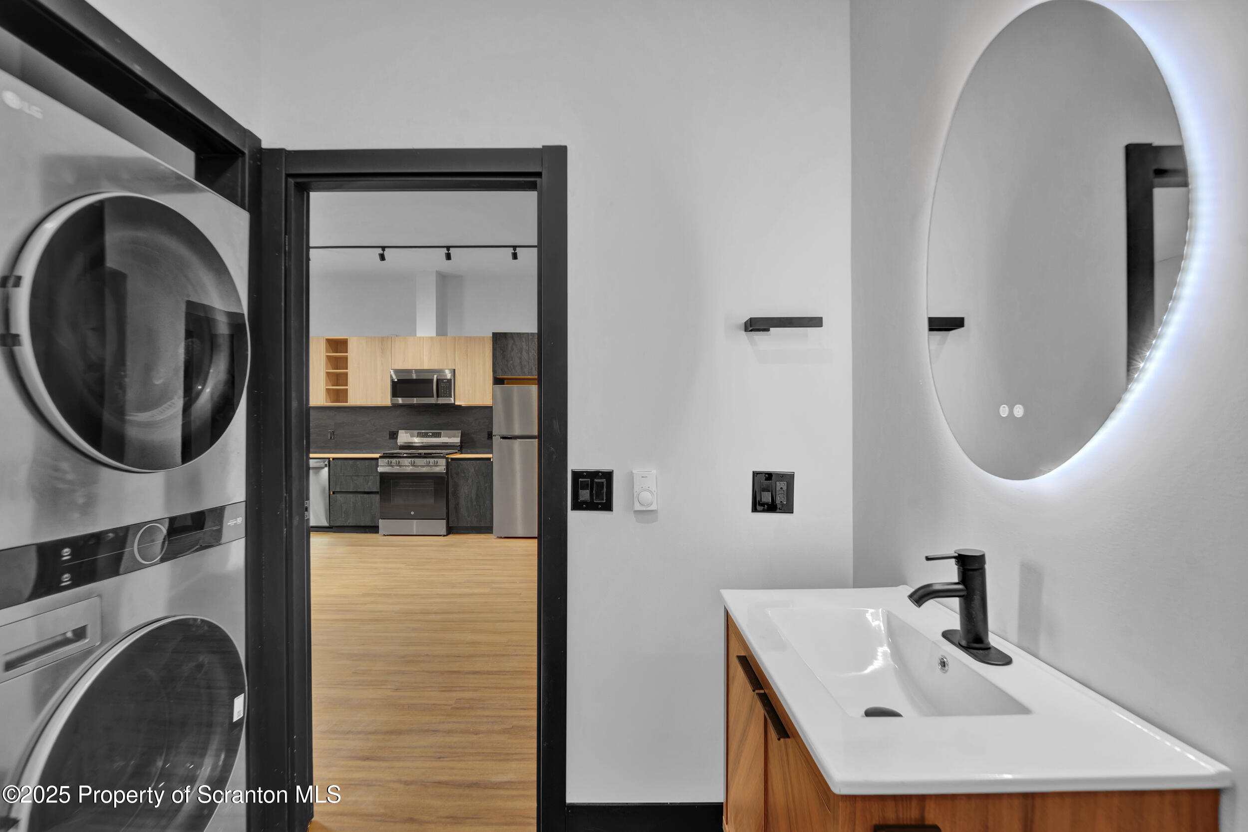 115 Penn Avenue, Unit 303 Scranton, PA 18503 - Photo 17 of 60 a bathroom with a sink a mirror and tub