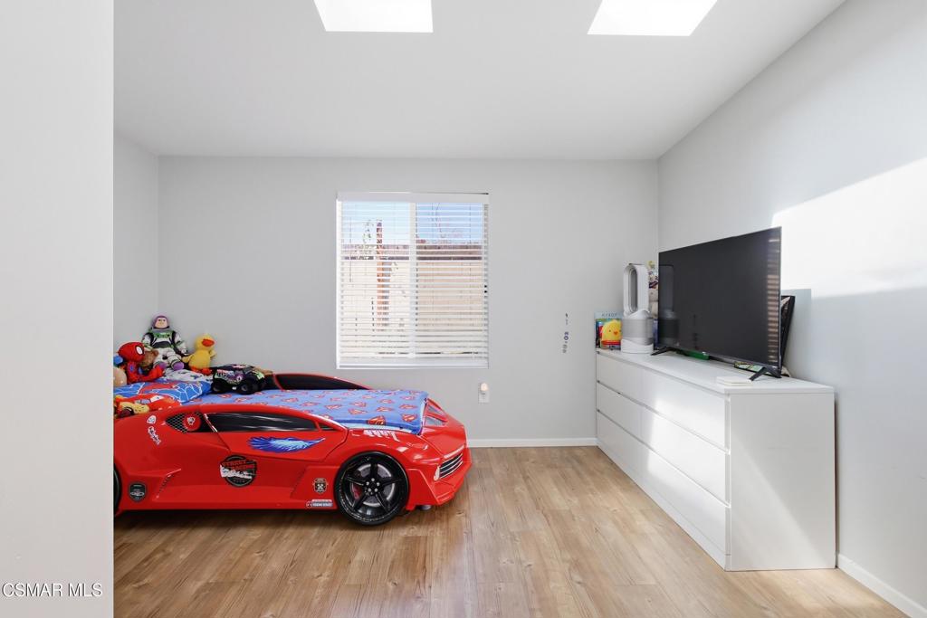 1485 Sequoia Avenue Simi Valley, CA 93063 - Photo 11 of 20 a bedroom with a bed and a flat screen tv