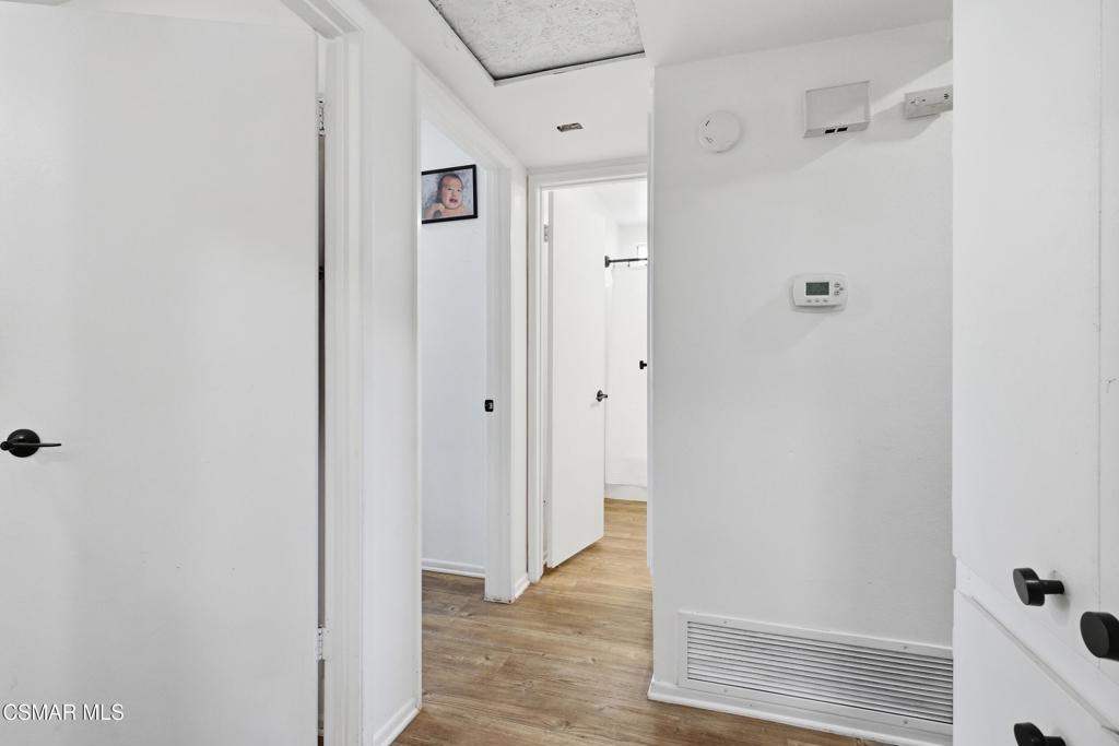 1485 Sequoia Avenue Simi Valley, CA 93063 - Photo 13 of 20 a view of a hallway with wooden floor