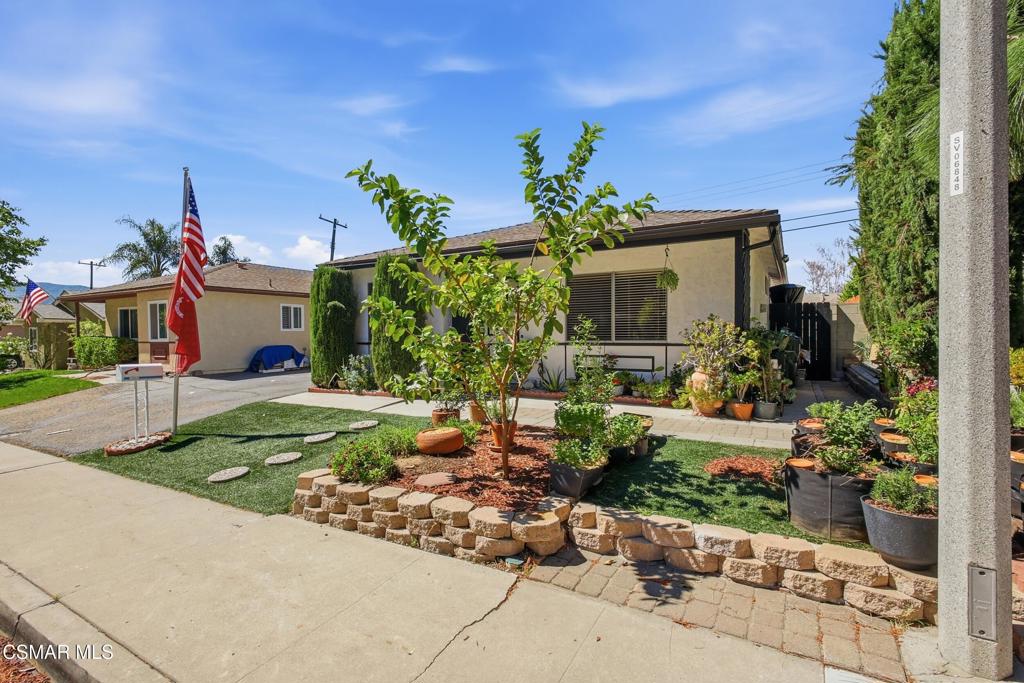 1485 Sequoia Avenue Simi Valley, CA 93063 - Photo 20 of 20 a front view of a house with a yard potted plants