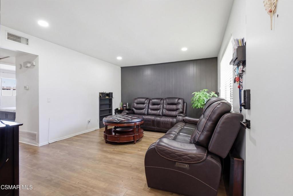 1485 Sequoia Avenue Simi Valley, CA 93063 - Photo 3 of 20 a living room with furniture and a potted plant