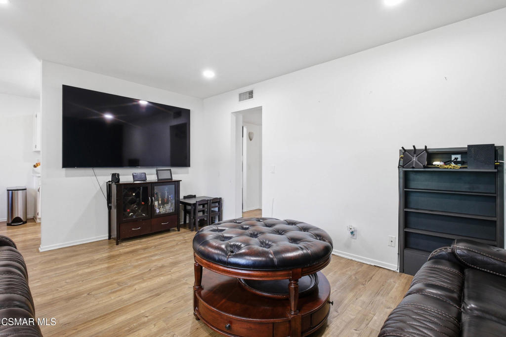 1485 Sequoia Avenue Simi Valley, CA 93063 - Photo 4 of 20 a living room with furniture and a flat screen tv