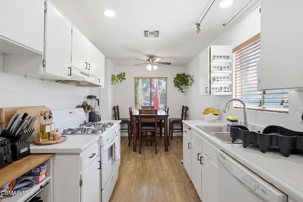 1485 Sequoia Avenue Simi Valley, CA 93063 - Photo 7 of 20 a kitchen with a sink stove and cabinets