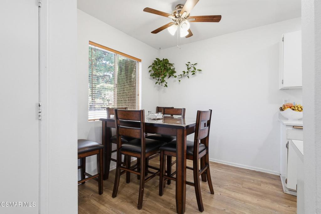 1485 Sequoia Avenue Simi Valley, CA 93063 - Photo 8 of 20 a dining room with furniture potted plants and wooden floor
