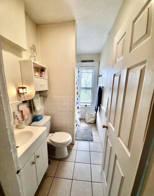 40 Forest Street, Unit 3 Boston, MA 02119 - Photo 11 of 20 a bathroom with a sink toilet and shower