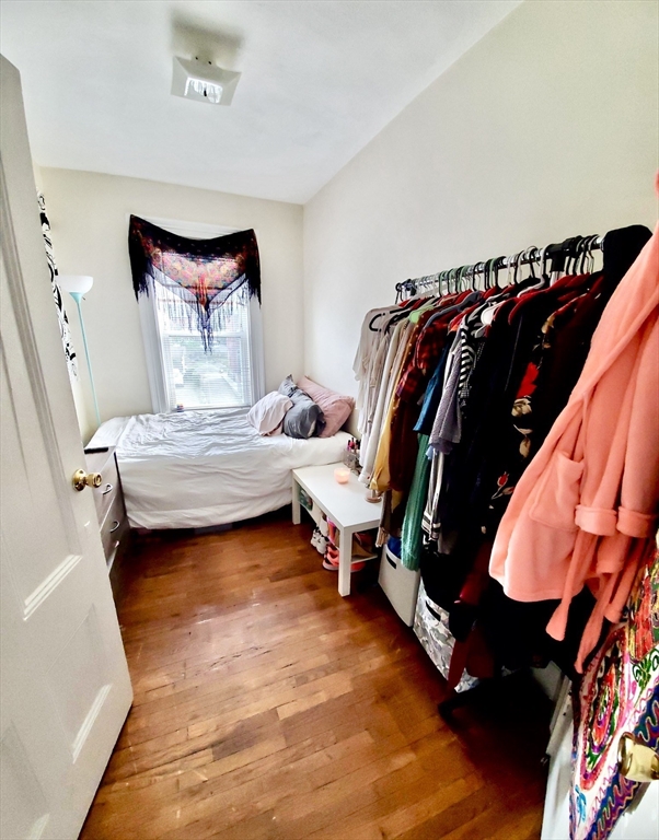 40 Forest Street, Unit 3 Boston, MA 02119 - Photo 17 of 20 a view of walk in closet with clothes and shoes