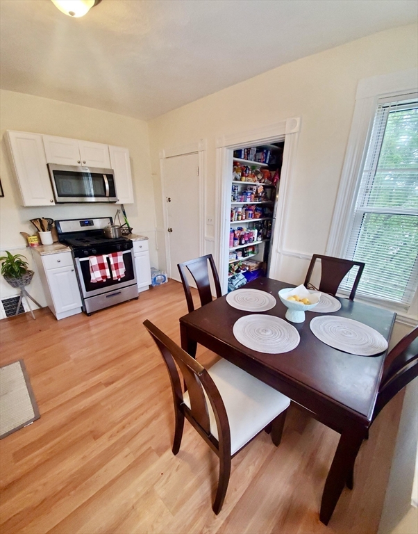 40 Forest Street, Unit 3 Boston, MA 02119 - Photo 5 of 20 a view of a dining room with furniture