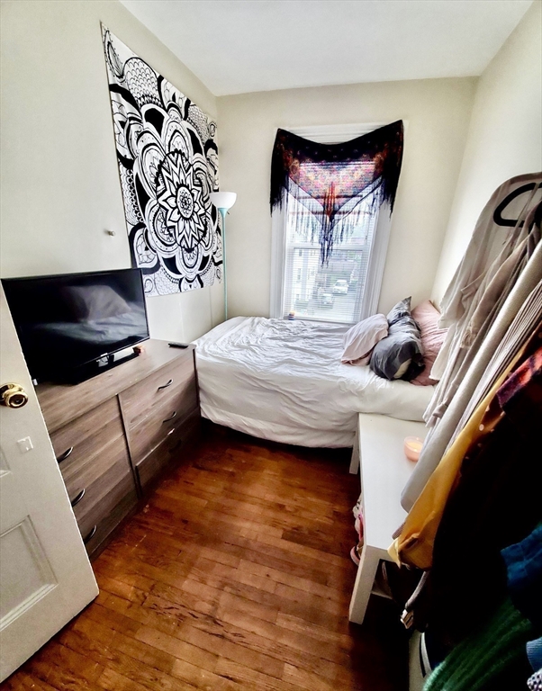 40 Forest Street, Unit 3 Boston, MA 02119 - Photo 9 of 20 a bedroom with a bed and window