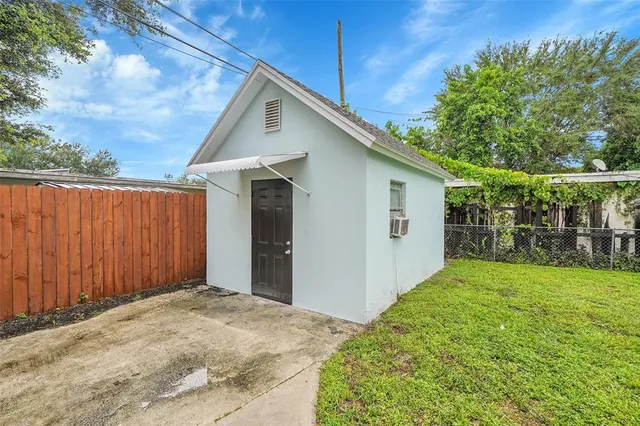 a view of a backyard of the house