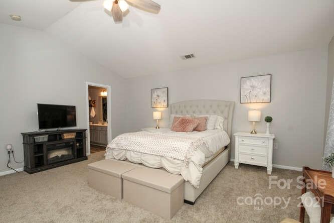 1431 River Run Road Lowell, NC 28098 - Photo 15 of 26 a bedroom with a bed and a flat screen tv