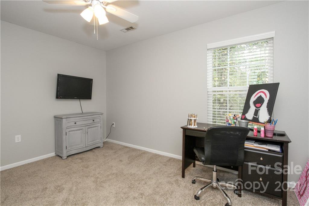 1431 River Run Road Lowell, NC 28098 - Photo 20 of 26 a view of a workspace with furniture and a window