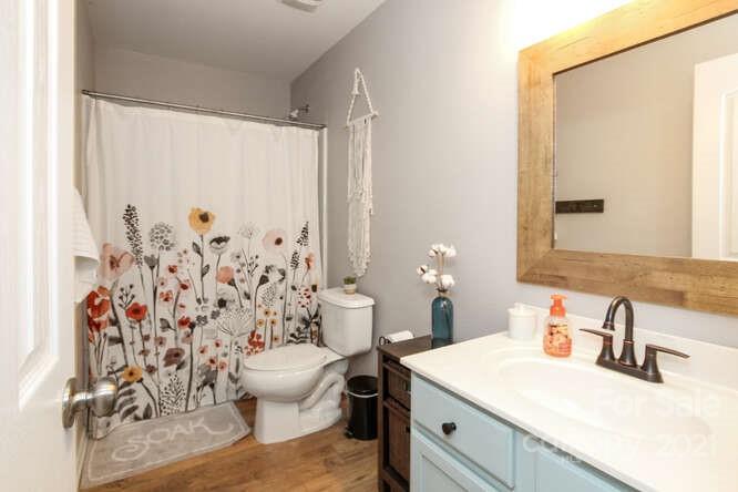 1431 River Run Road Lowell, NC 28098 - Photo 21 of 26 a bathroom with a sink toilet and shower