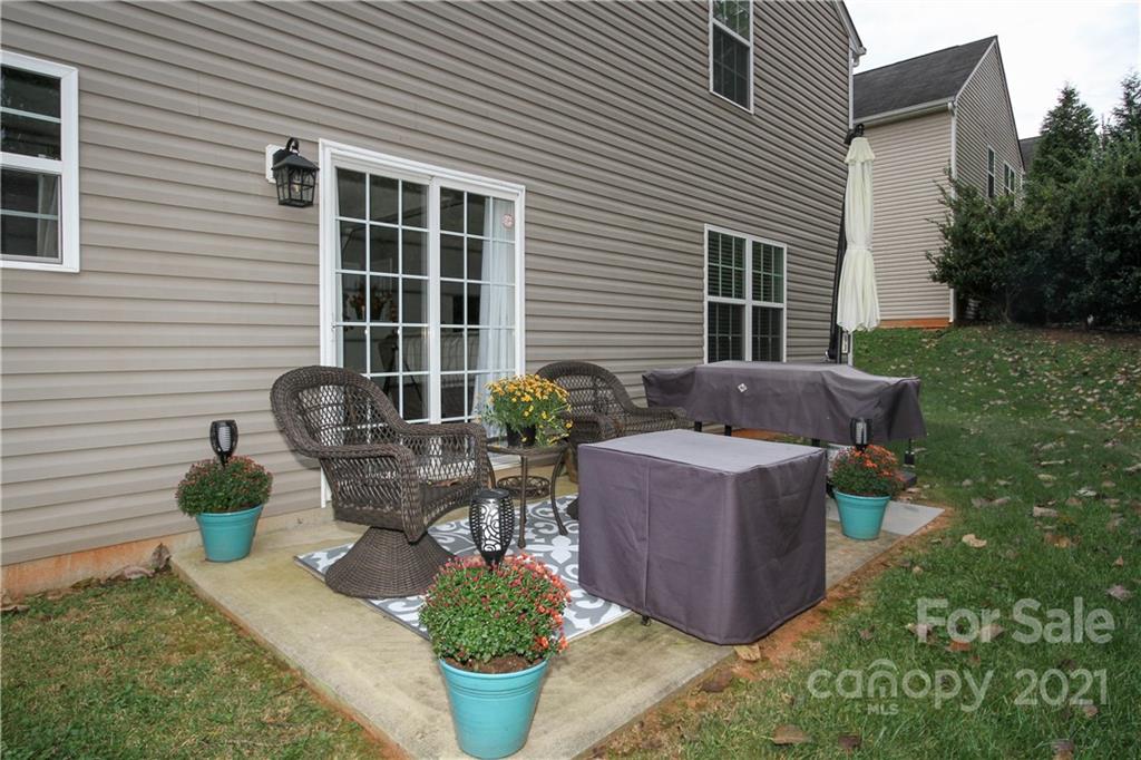 1431 River Run Road Lowell, NC 28098 - Photo 24 of 26 a view of a backyard with plants and patio