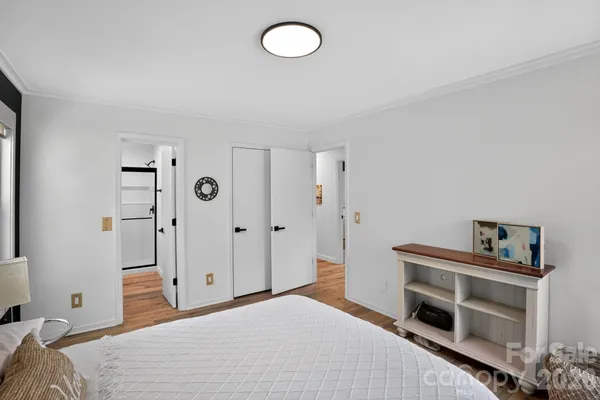 a white house with a yard and sitting area