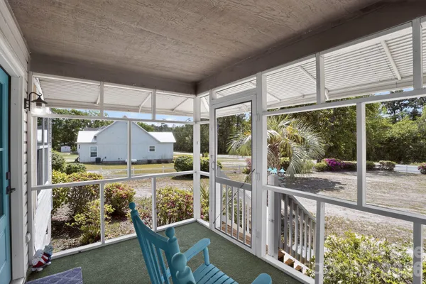 a view of a swimming pool with an outdoor space and seating area