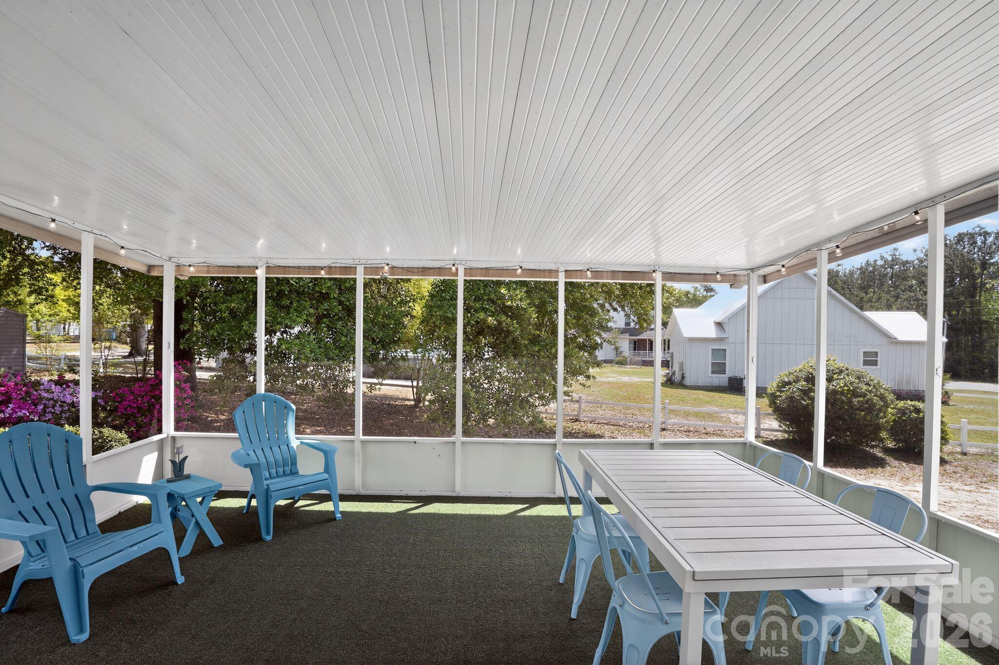 1724 Camp Shelor Road Manning, SC 29102 - Photo 25 of 48 a outdoor space with patio the couches and dining table with garden view