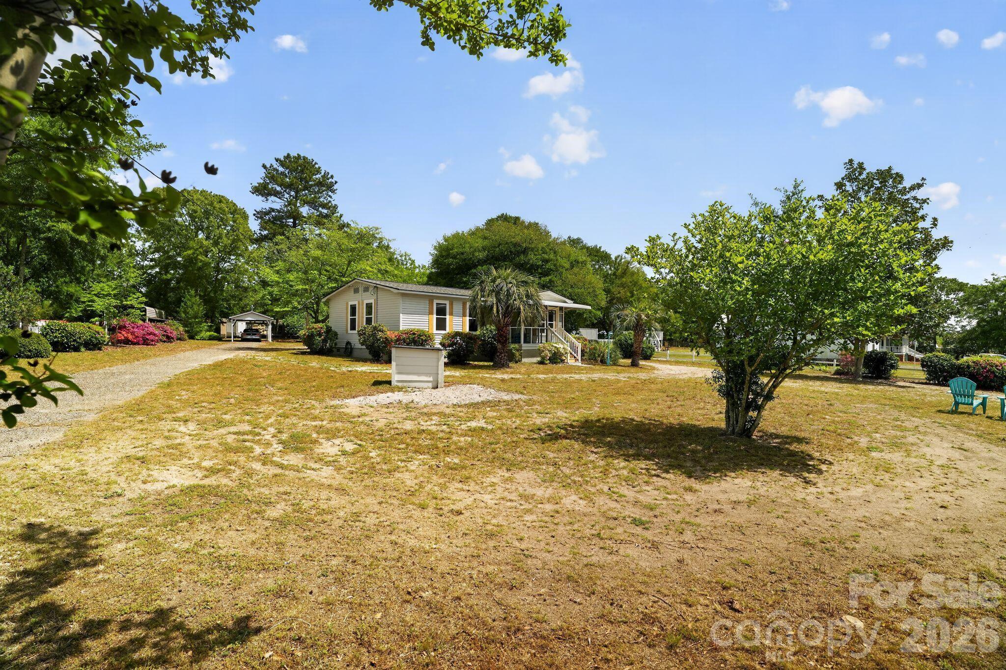 1724 Camp Shelor Road Manning, SC 29102 - Photo 32 of 48 a swimming pool with outdoor seating and yard